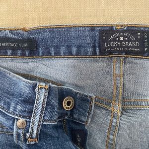 Lucky Brand slim jeans with a few imperfections.